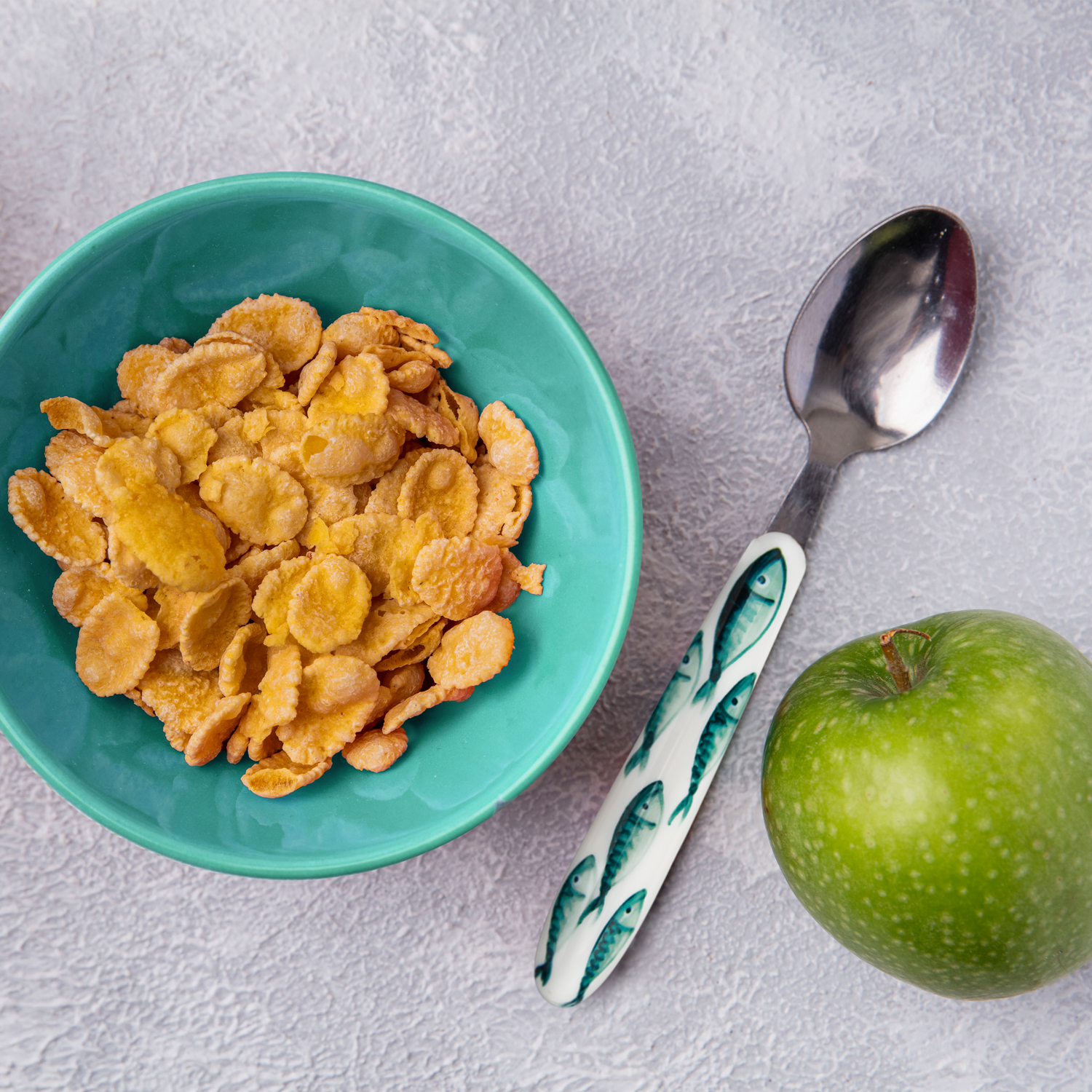 Cucchiaino con manico decorato pesci