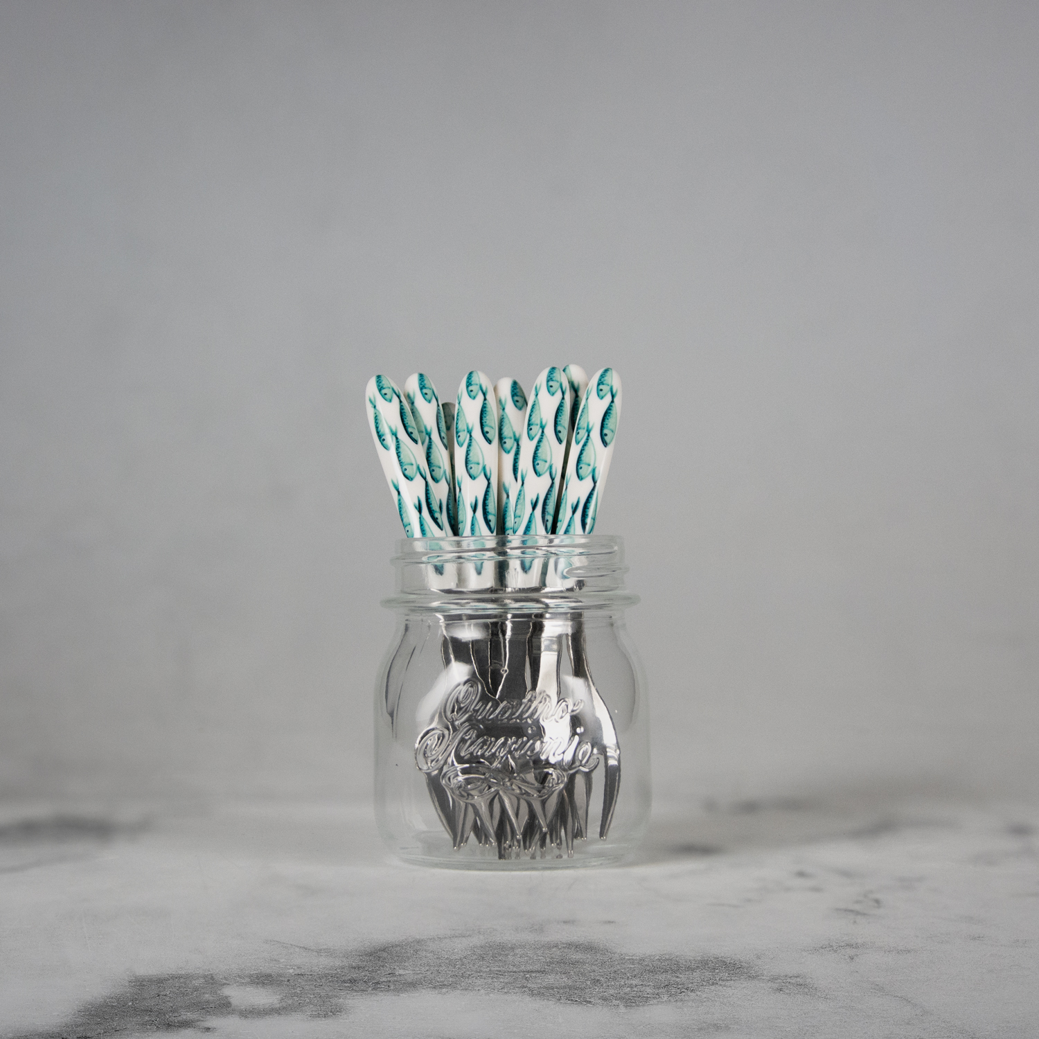 Forchetta dolce con manico decorato pesci